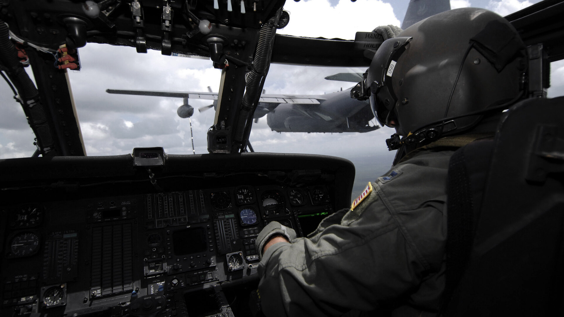looking through a cockpit from behind the pilot